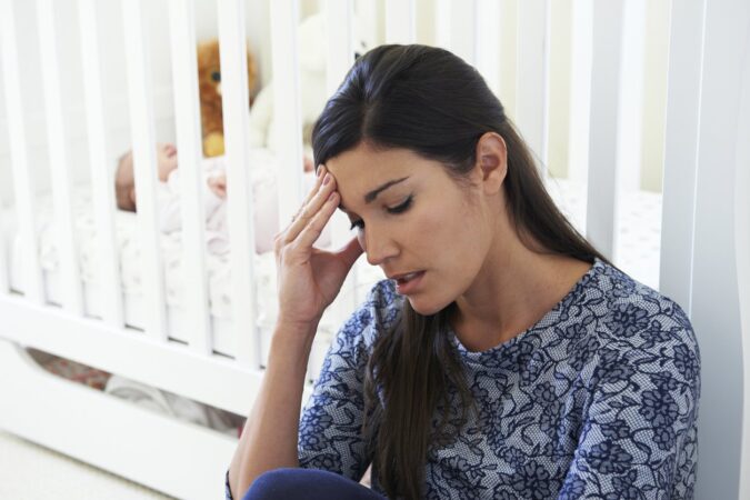 Frustrated Mother Suffering From Post Natal Depression postpartum depression